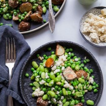 edamame and potato salad on bowl next to dish of almond ricotta, salad dressing and fork