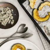squash on baking sheet beside serving spoons, hemp on a dish