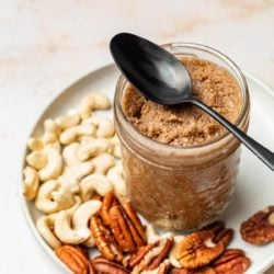 homemade nut butter in glass jar with spoon