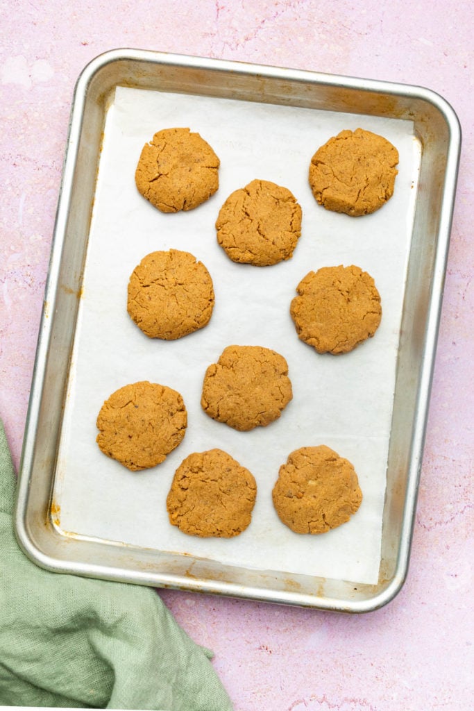 peanut butter cookies on parchment lined baking sheet