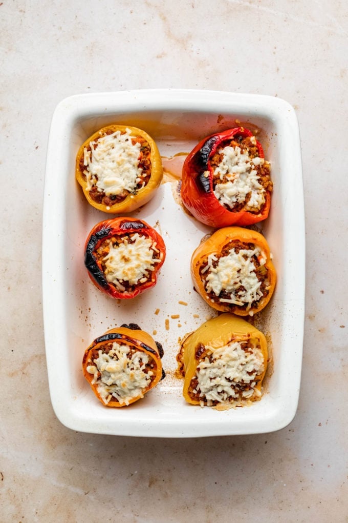 vegan stuffed peppers with beyond meat in baking dish