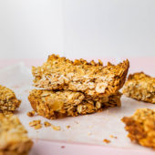 stack of low fodmap granola bars on parchment