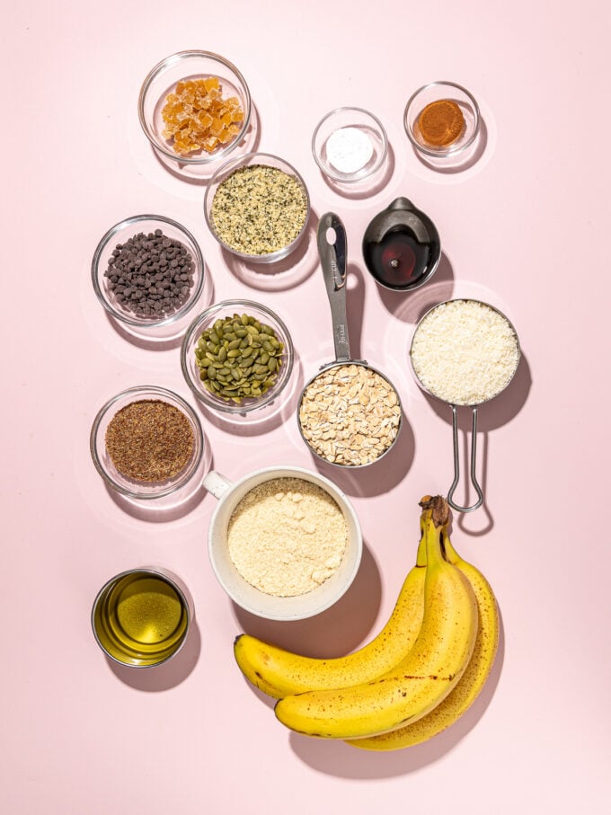 bananas, bowls of almond flour, pumpkin seeds and oats and spices