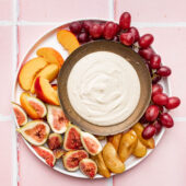 cashew cream vegan fruit dip in bowl with fruit