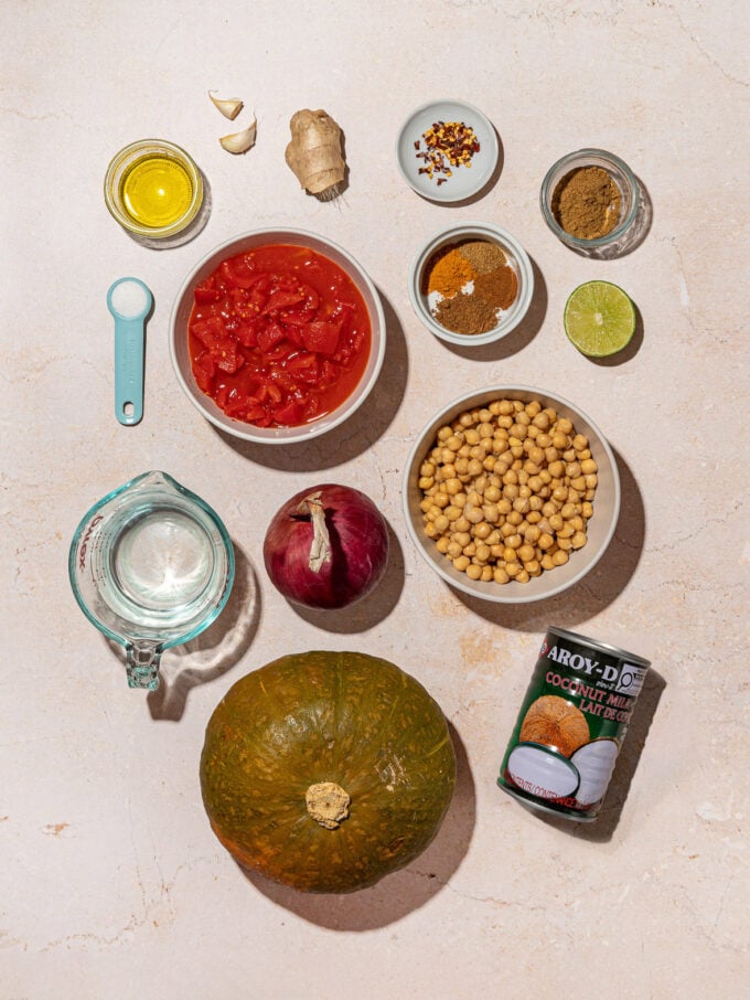 kabocha squash, bowls of chickpeas, tomatoes and spices