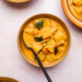 kabocha squash curry in bowls with spoon