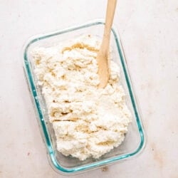 vegan ricotta in glass dish with spoon