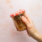 hand shaking sesame dressing