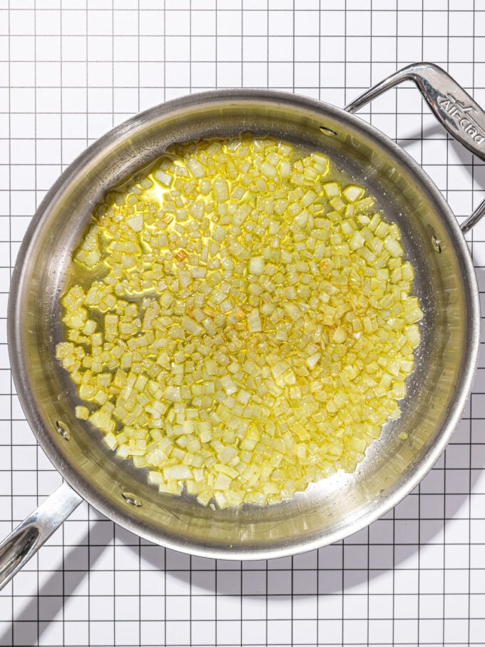 stainless steel skillet with cooked onions