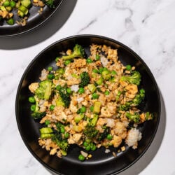 black bowls with broccoli tofu fried rice