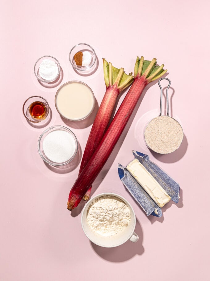 rhubarb stalks with bowls of flours, spices and butter