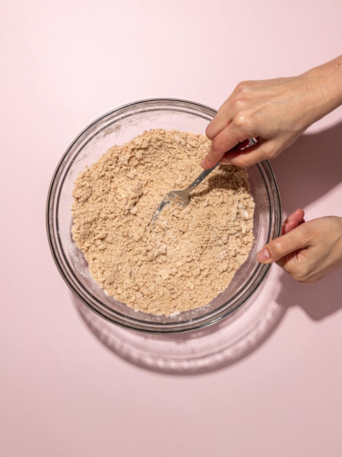 hand stirring scone dough with fork