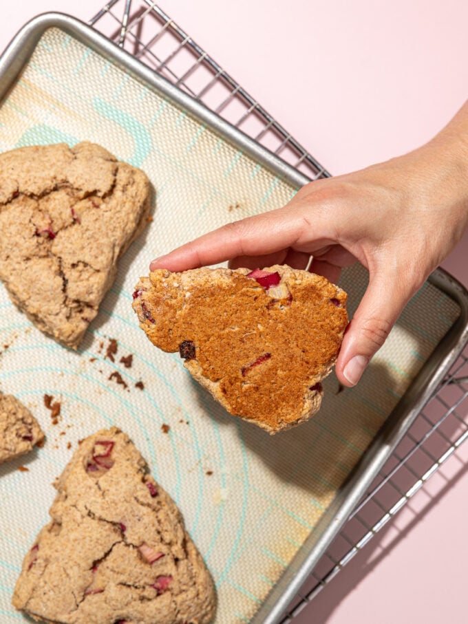 hand holding scone with browned bottom