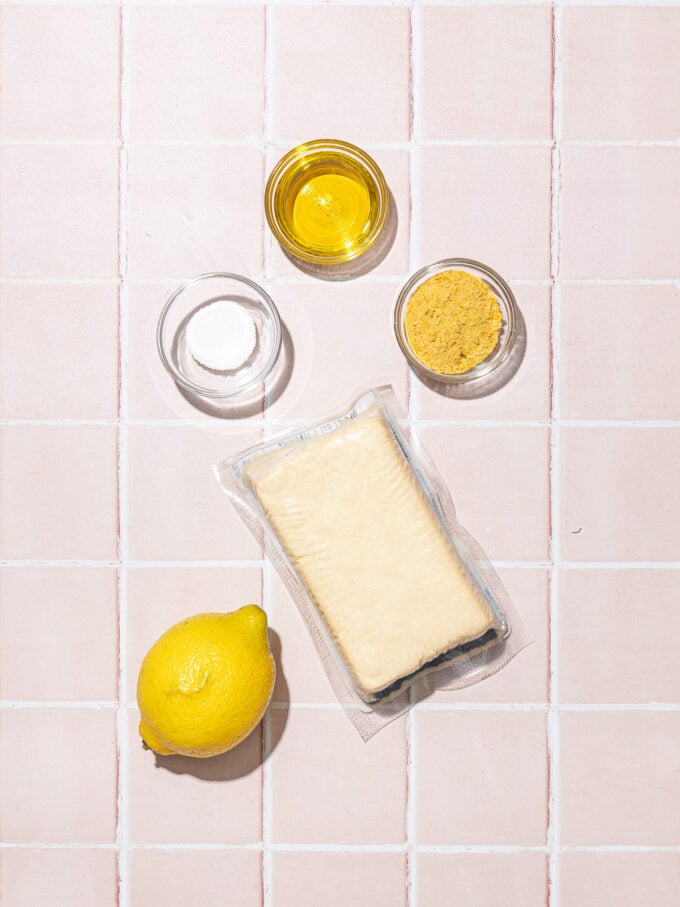 block of tofu, a lemon, oil, salt and nutritional yeast