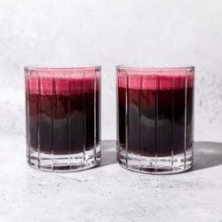 two glasses of red beet juice side by side