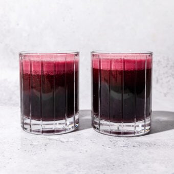 two glasses of red beet juice side by side