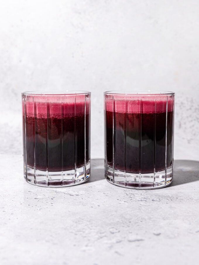 two glasses of red beet juice side by side