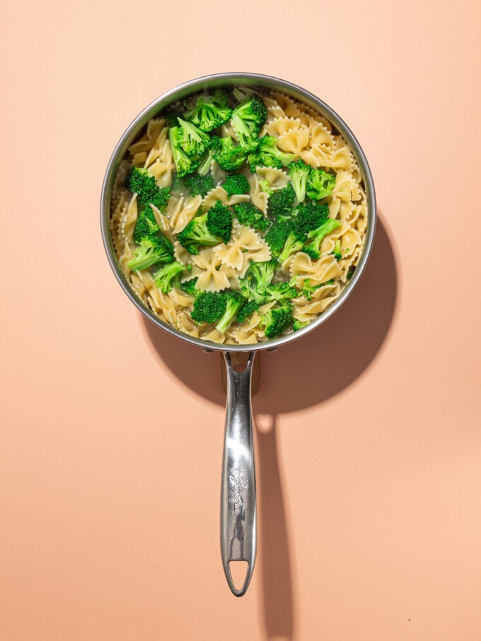 pot with cooked pasta and broccoli inside it