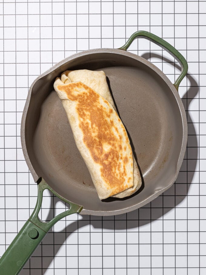 grilled breakfast burrito in skillet