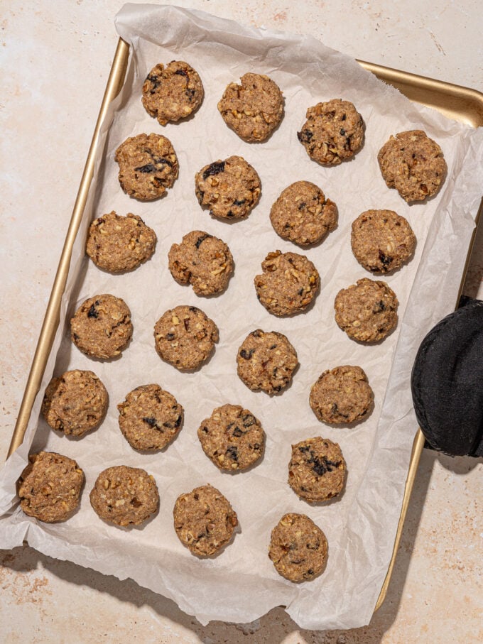baked high fiber prune cookies on parchment-lined baking sheet